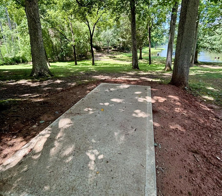 Tee box of disc golf hole overlooking Mallard Lake
